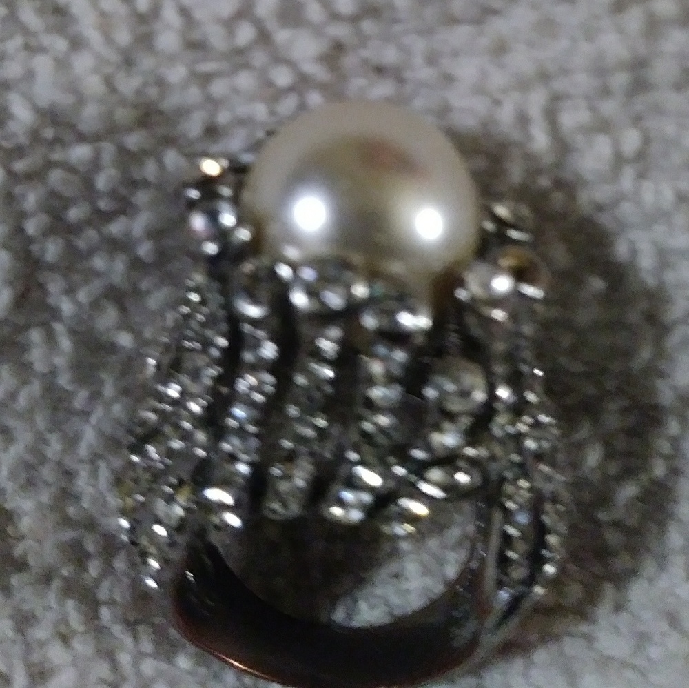 Pearl white crystal ring.